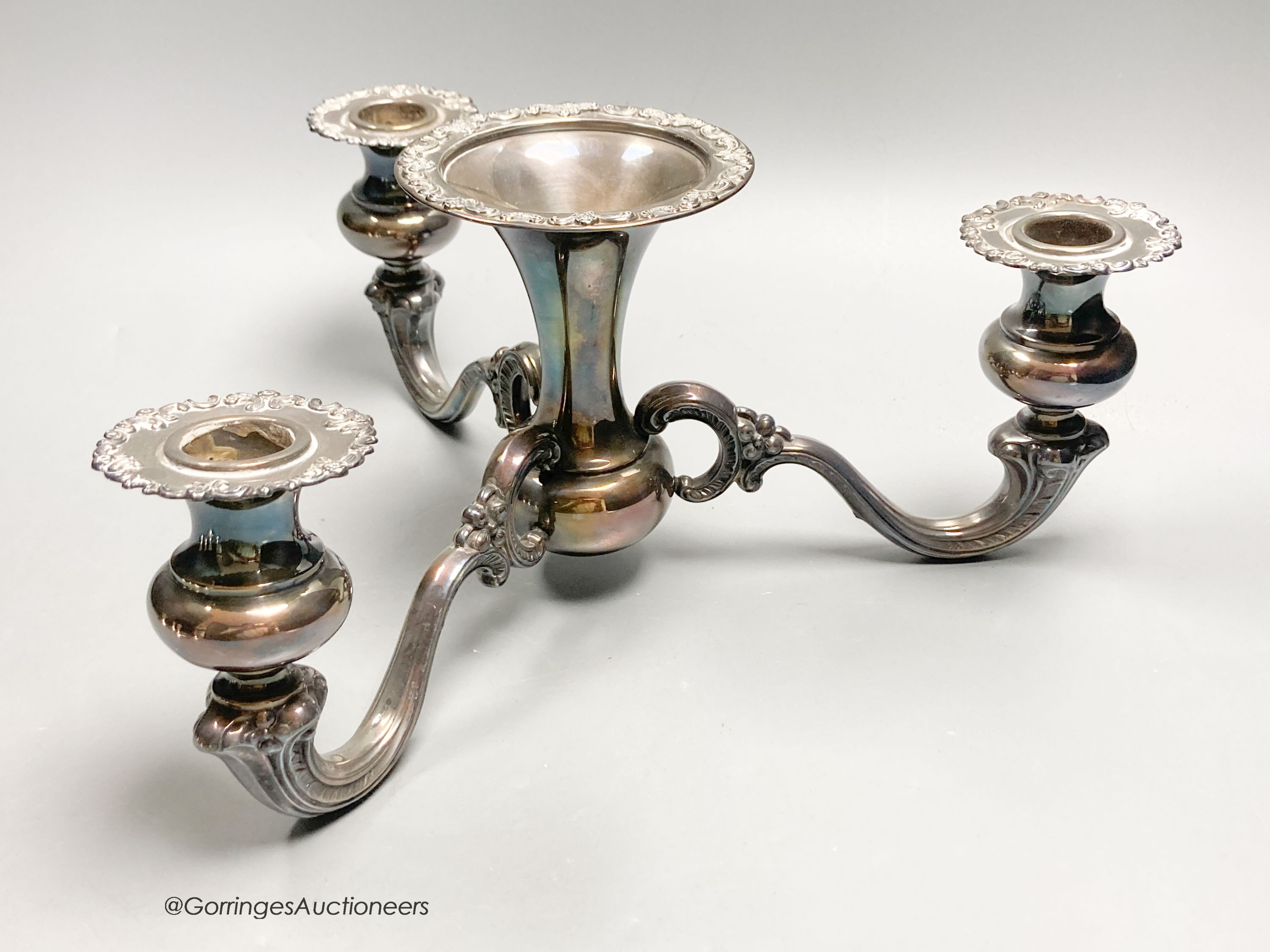 An American sterling three-branch candelabrum, 9.5oz and two pairs of similar dwarf candlesticks, 88mm, weighted.
